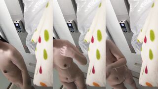 The slut in glasses takes a selfie while washing her hair and rubbing her breasts