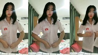 Student girl reveals a pair of big tits