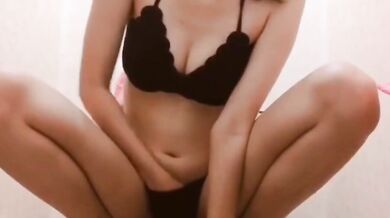 Japanese girl masturbates and pees in her panties
