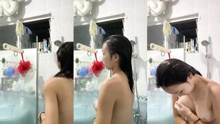 Singaporean girl takes a selfie while bathing