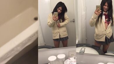 Cute Japanese college student sister takes selfie in toilet