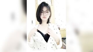 Innocent glasses girl takes sexy selfie in pajamas