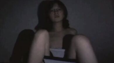 The girl in glasses takes a sexy selfie late at night