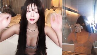 Japanese beauty masturbates with fake dick in bathroom