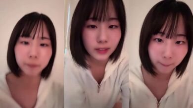 Squinting cutie flashes a flirty smile