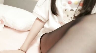 Sister Moans Seductively in Black Stockings on Bed