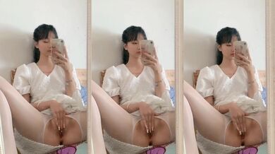 Contrasting Beauty in White Stockings Touches Herself Before the Mirror