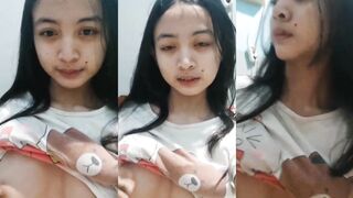 Young woman flaunts her assets seductively