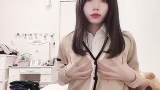 Cute Japanese Girl Caressing Her Breasts