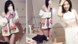 Fresh short-haired girl takes sexy selfie in the mirror