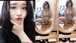 Busty Short-Haired Girl Strips Nude Before Mirror