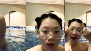 Busty Glasses Girl Goes Skinny Dipping in Hotel Pool