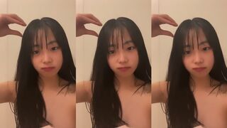 Cute Japanese girl takes bath selfie