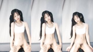 Double ponytail girl dancing on the sofa