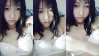 Cute thin breast girl selfie on the bed