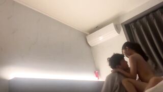 Korean couple takes selfie in hotel