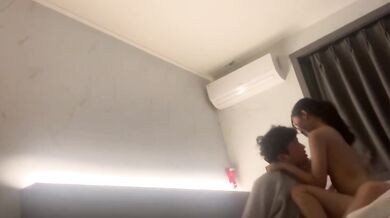 Korean couple takes selfie in hotel