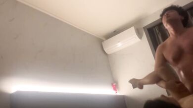 Korean couple takes selfie in hotel