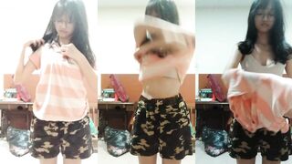 Malaysian cute escort strips naked and puts it back on
