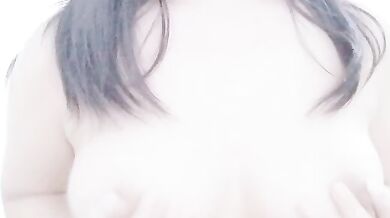 Malaysian escort KMH playing with breasts selfie