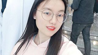 A slut wearing glasses is naked and chatting with her boyfriend