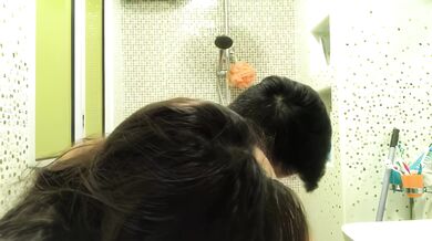 Singaporean young couple takes selfie in toilet