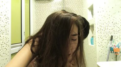 Singaporean young couple takes selfie in toilet