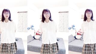 Cute four-eyed girl takes selfie without school uniform
