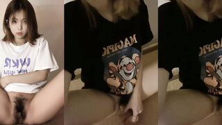 Tattooed bitch masturbates with a fake dick