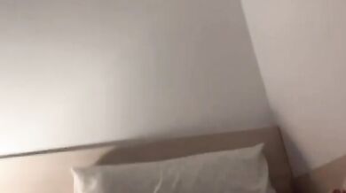 Bitch bites her panties and walks on the bed